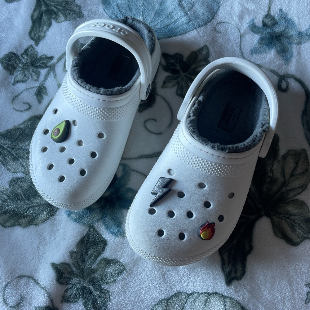 White and gray plush crocs with jibitts